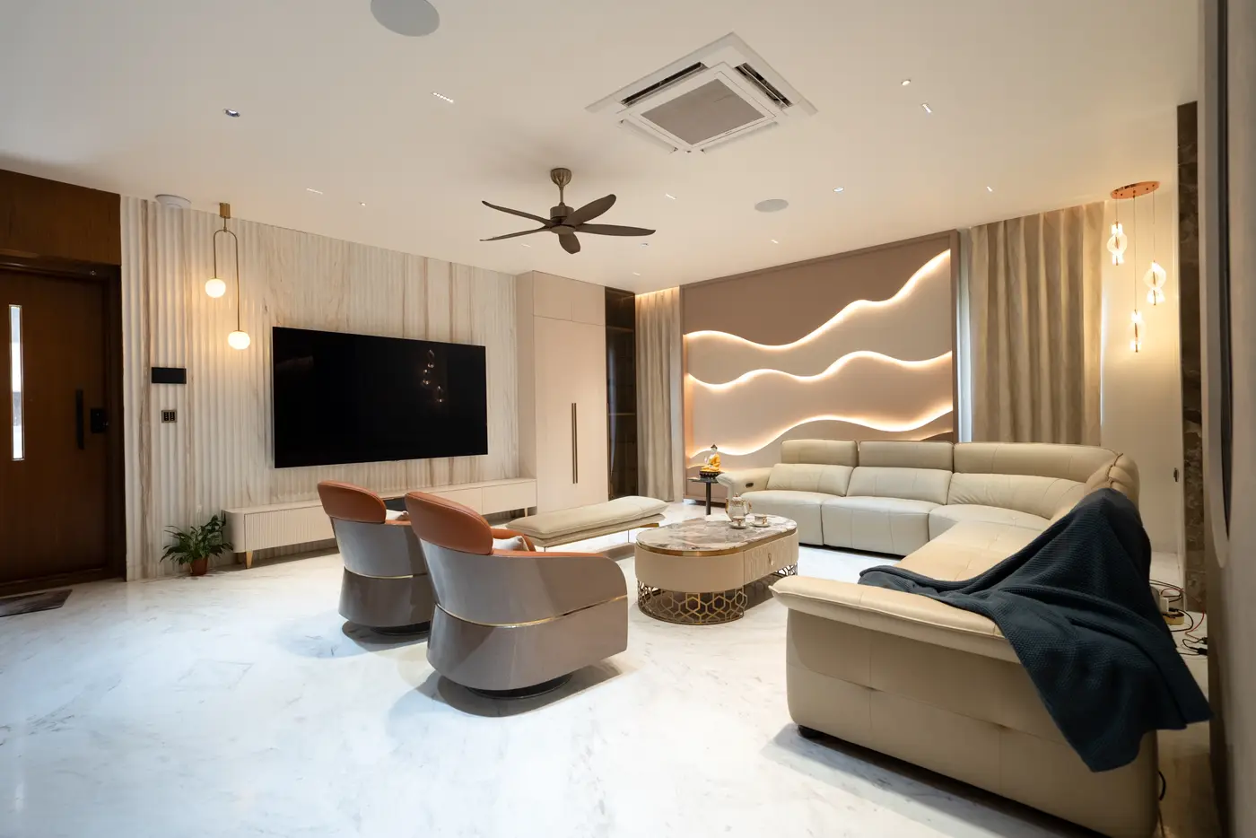 Wide living room with floor-length curtains framing the feature wall